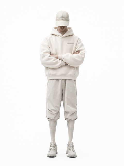 Hannovae Cloud Hoodie in cream, boxy fit, styled standing