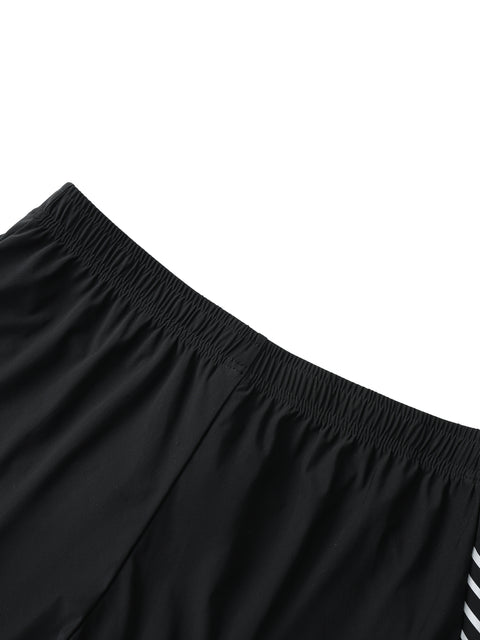 Close-up of black shorts with a white background